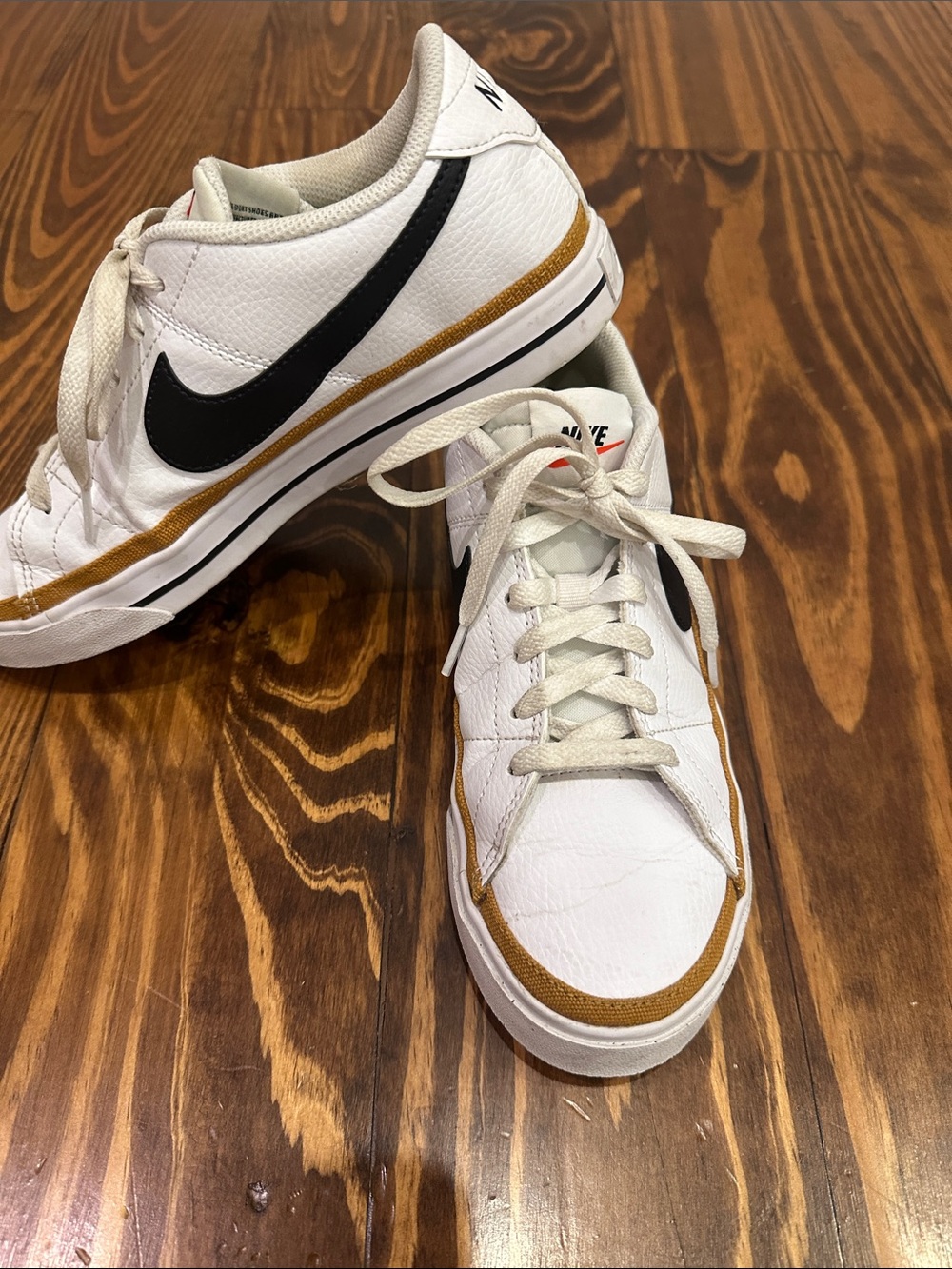 Nike White Sneakers with Mustard Trim and Black Swoosh